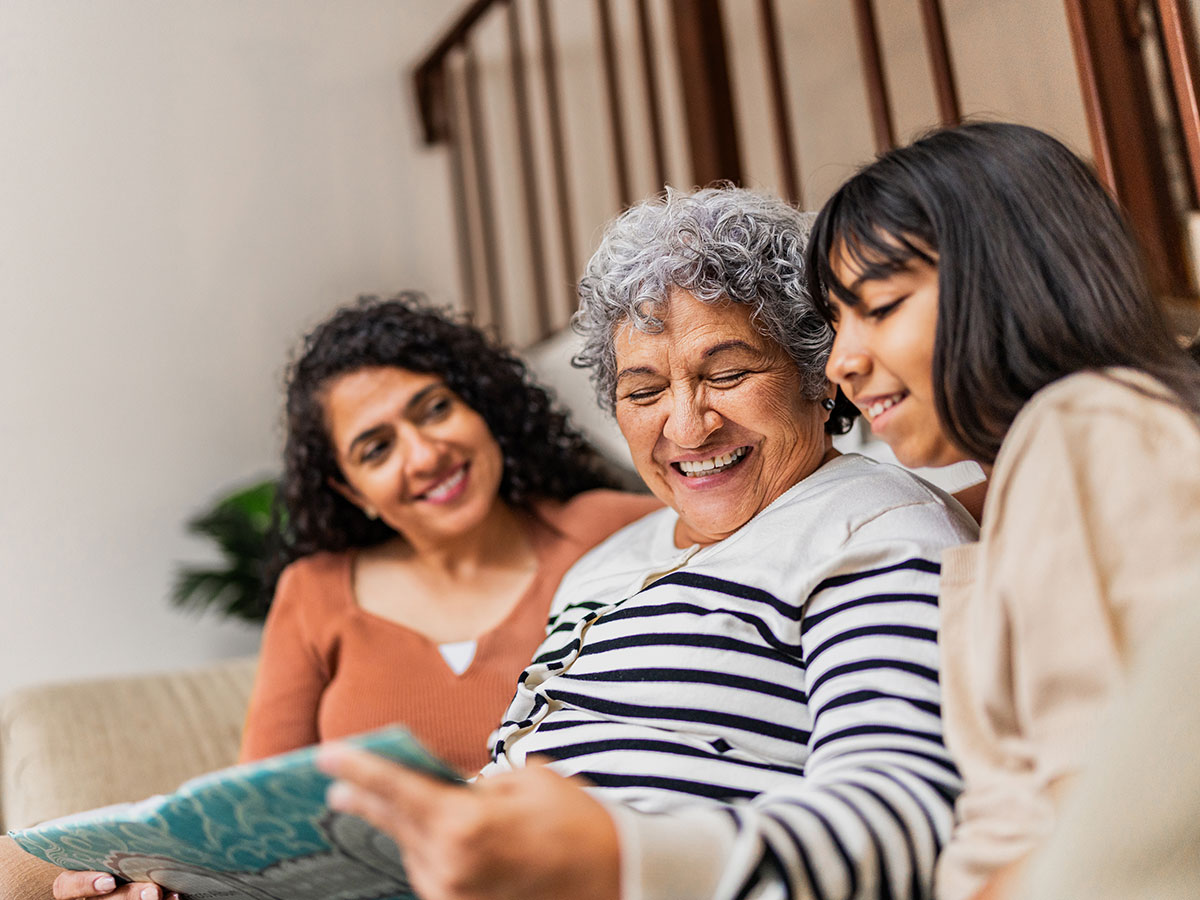 Image of family reading a book