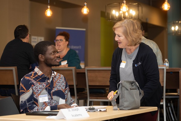 Annette helps a job seeker at our 2023 Job Seminar
