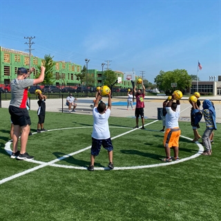 Group of children playing soccer