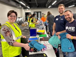 Eaton volunteers pack backpacks