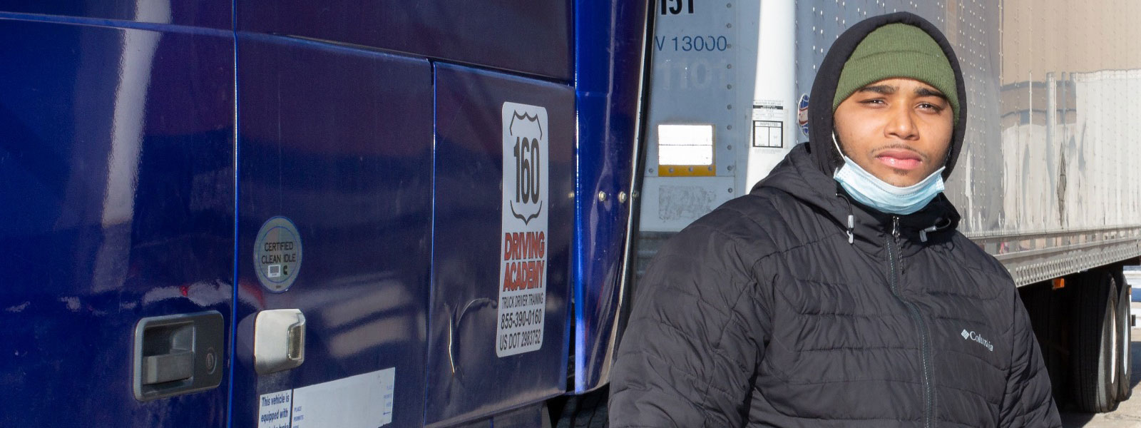 Leon standing by truck