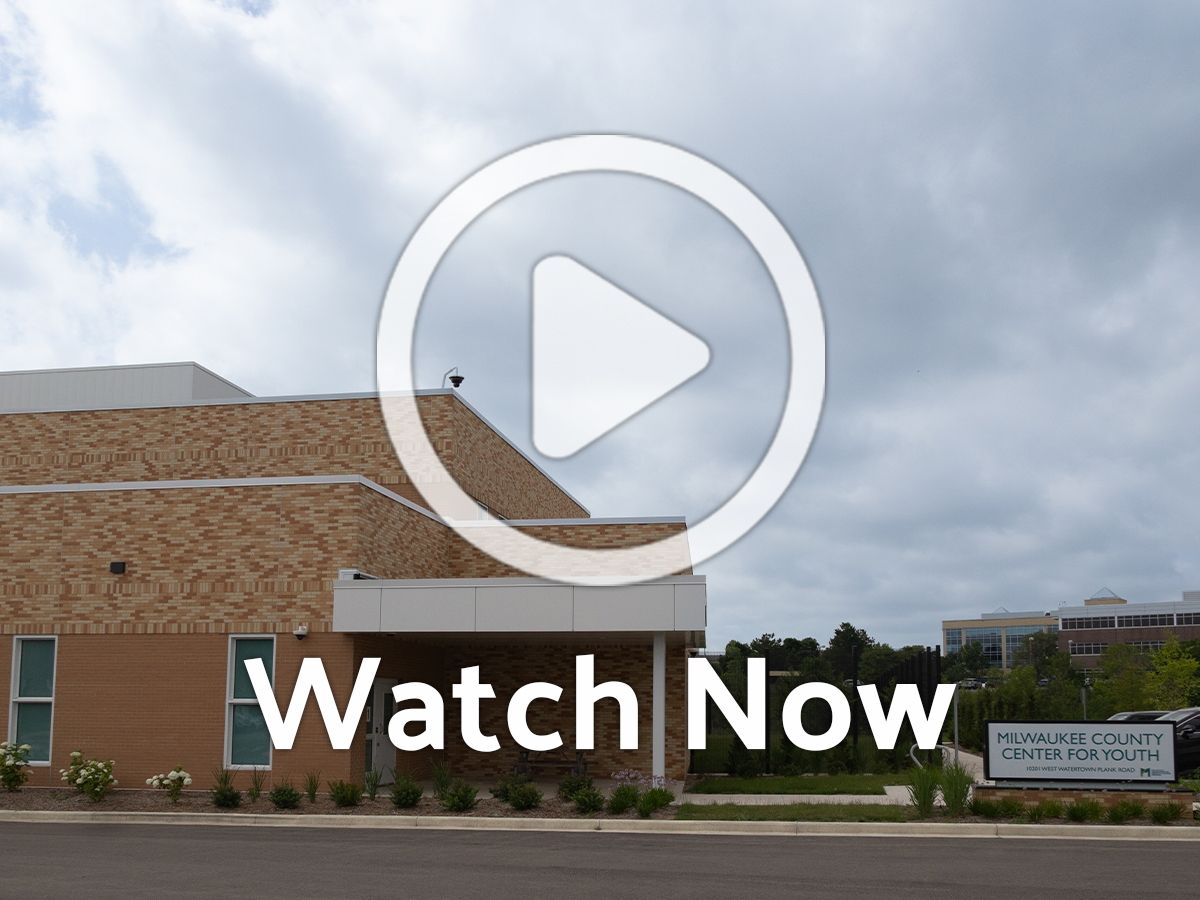 School building with overlay play button