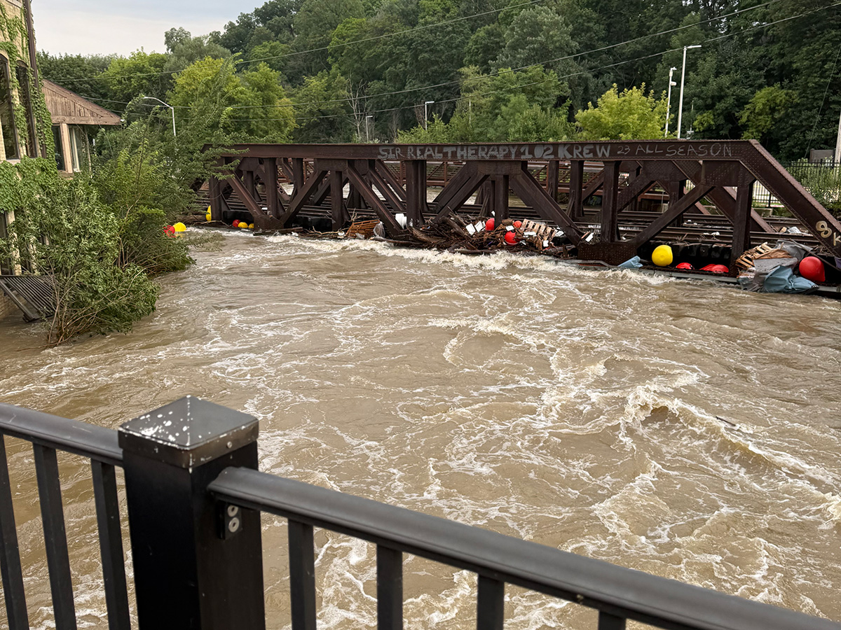 image of flooding by railroad bridge
