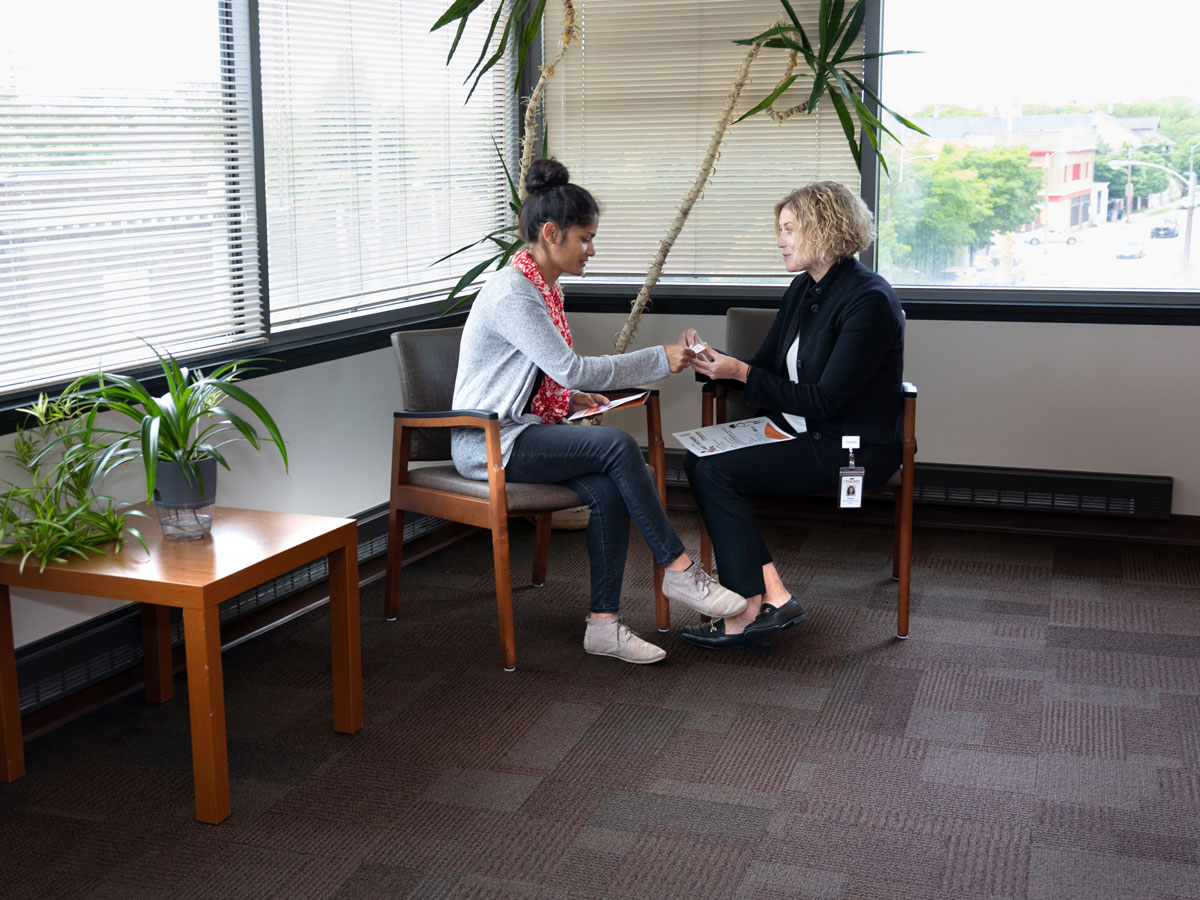 Two people at table in office