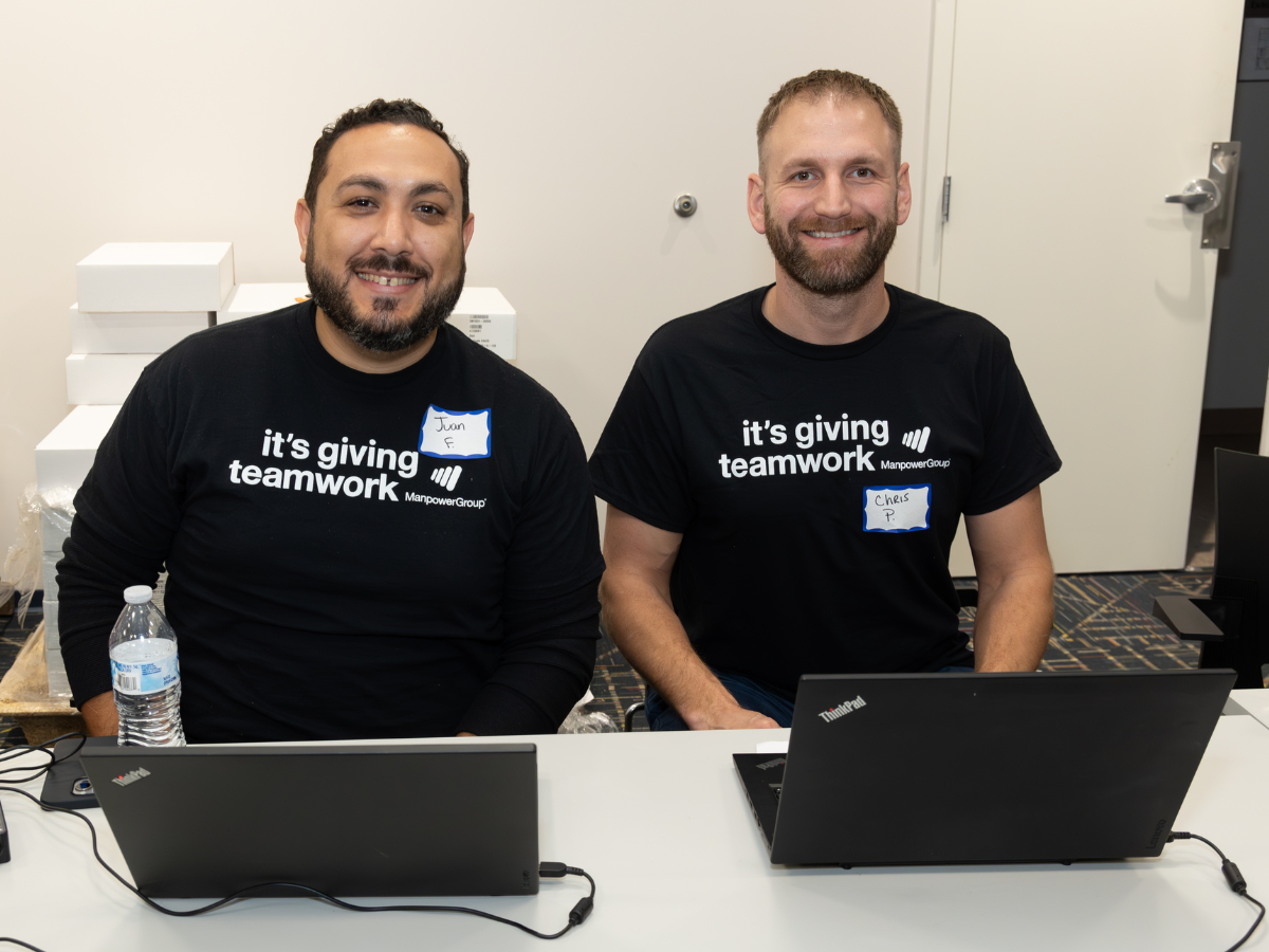 Image of two people with laptops