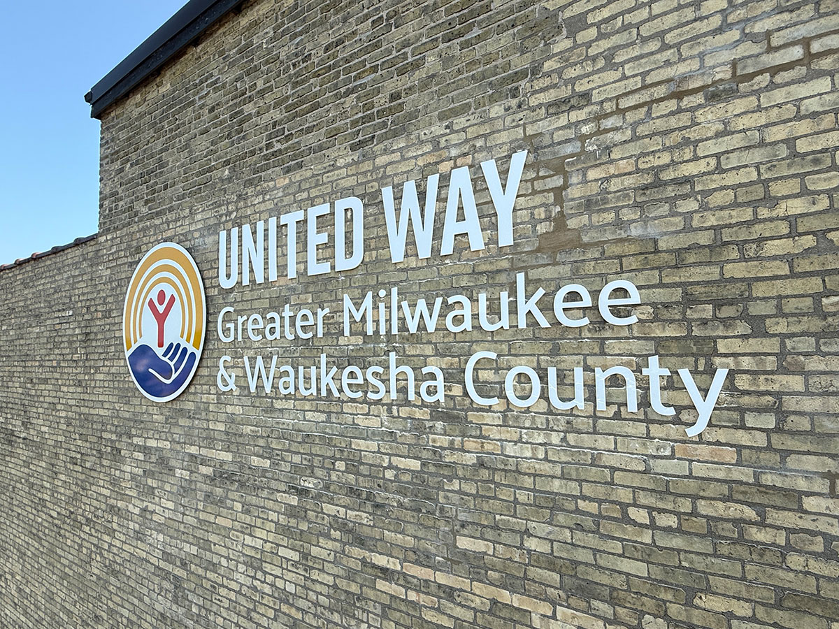 photo of United Way logo on the brick building wall