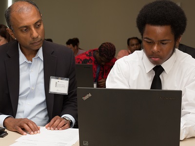 A community member receives digital help.