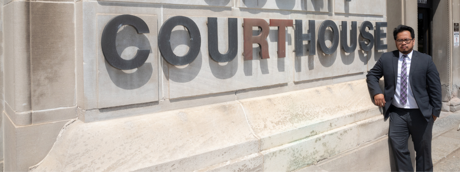 Man in front of courthouse