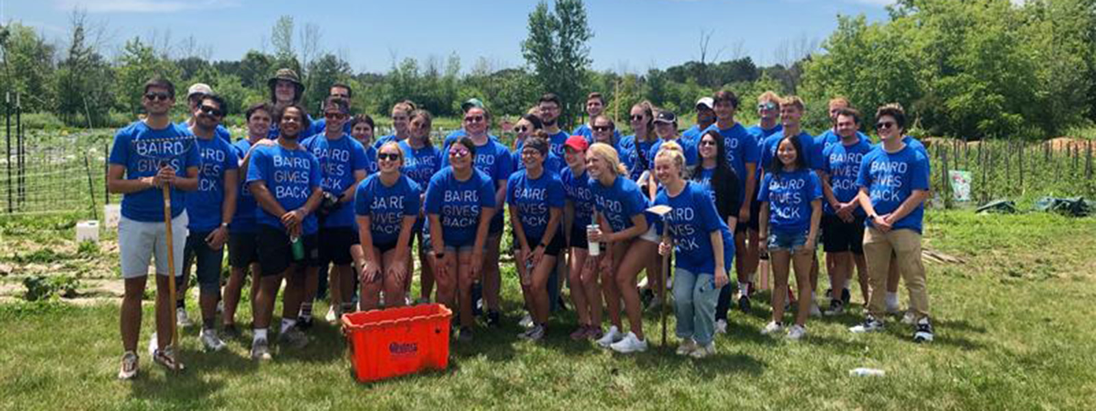 group of interns volunteering outside