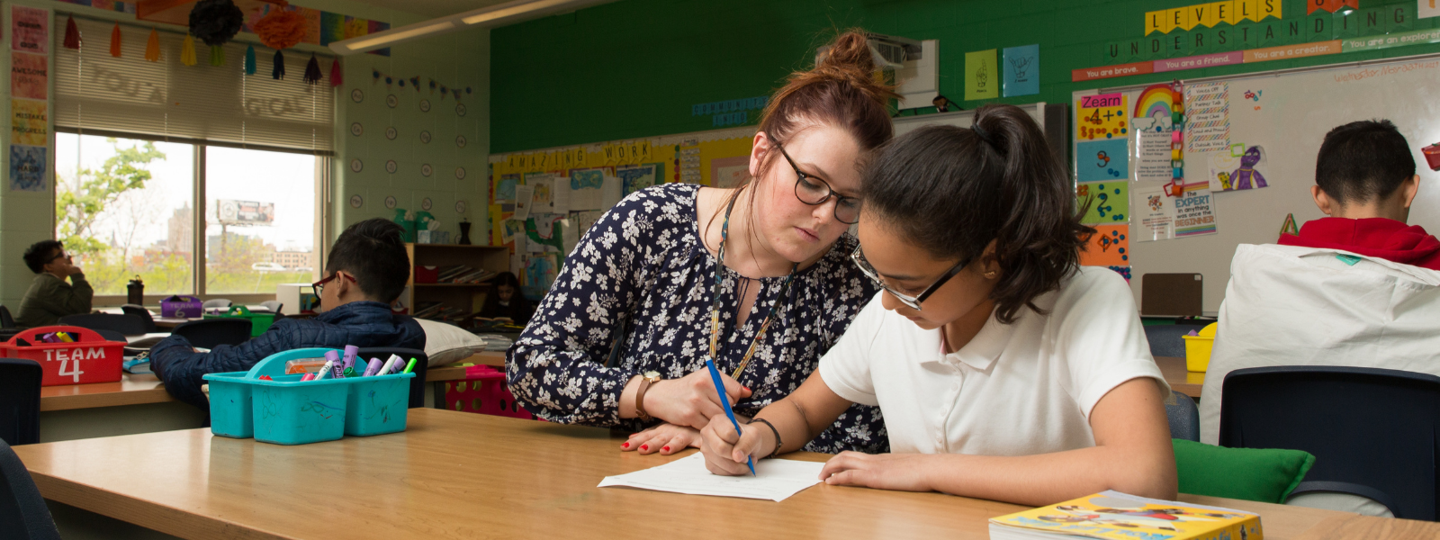 Girl writing in class