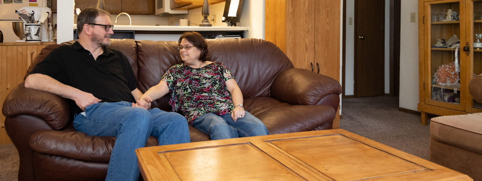 Couple on sofa of their home