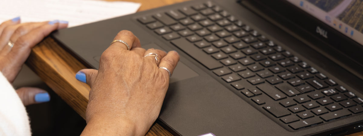 An older adult on a computer.
