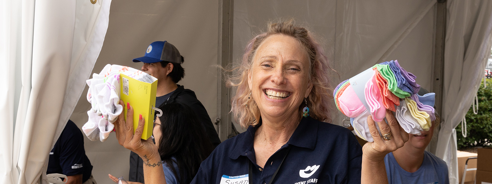 women holding new socks packages in her hands