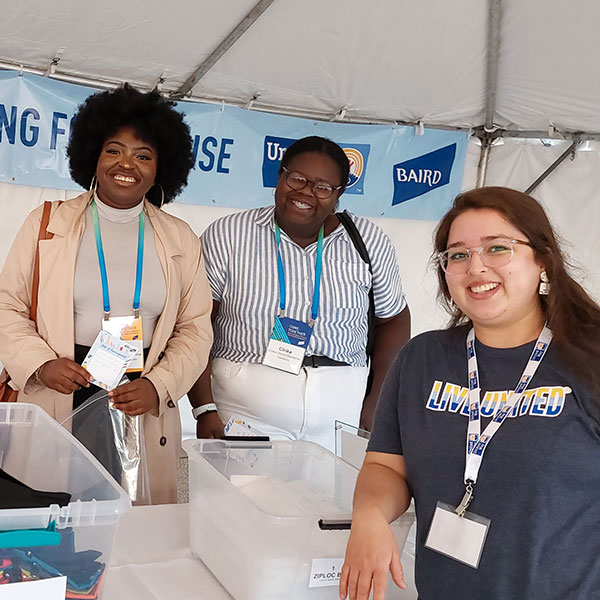 three women at a volunteer event