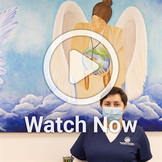 image woman in medical office with a play overlay button