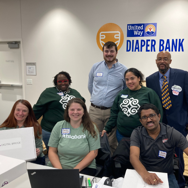 Kris Szatmary and others volunteer at a Techquity Device Distribution event