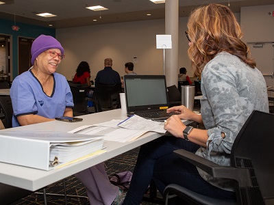 VITA volunteers help community members file their taxes
